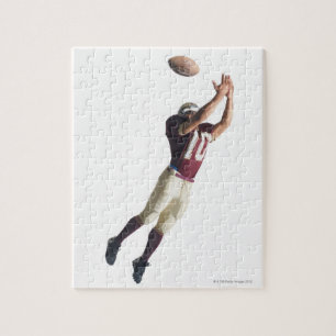 an african american football player in a red and jigsaw puzzle