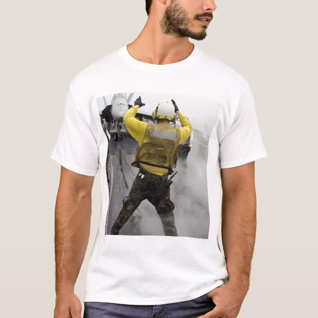 An aircraft director signals a F/A-18C Hornet T-Shirt (Front)
