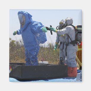 An airman stands in a tub magnet
