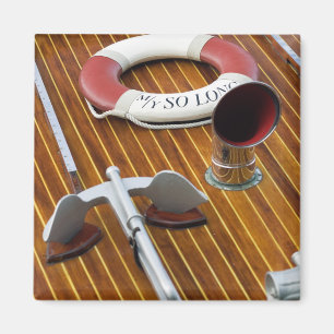 An Anchor And A Life-Buoy On A Wooden Boat Magnet