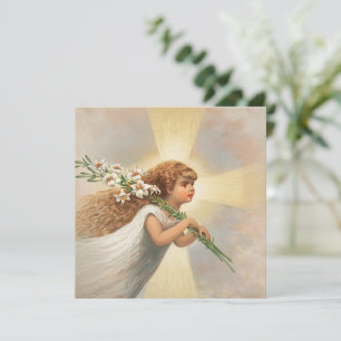 An angel in the sky holding lilies christmas holiday card
