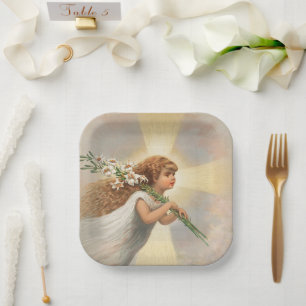 An angel in the sky holding lilies christmas paper plate