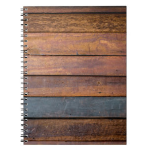 An antique wood wall texture background with metal notebook