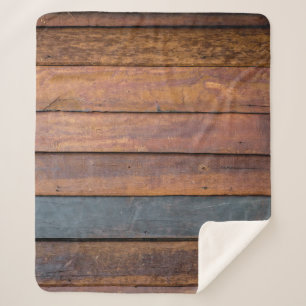 An antique wood wall texture background with metal sherpa blanket