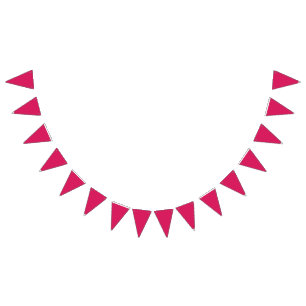 An array of red and pink flowers with lush green l bunting 