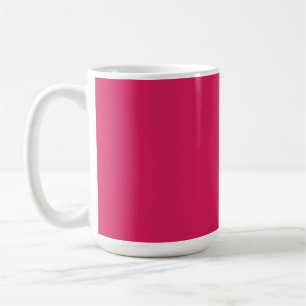An array of red and pink flowers with lush green l coffee mug