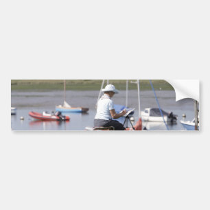 An artist at Bosham Harbor, West Sussex, England. Bumper Sticker