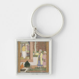 An artist decorating the interior of a garden pavi key ring
