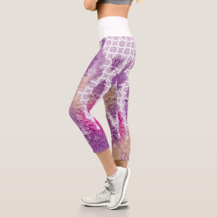 An artistic pattern displaying shades of purple an capri leggings