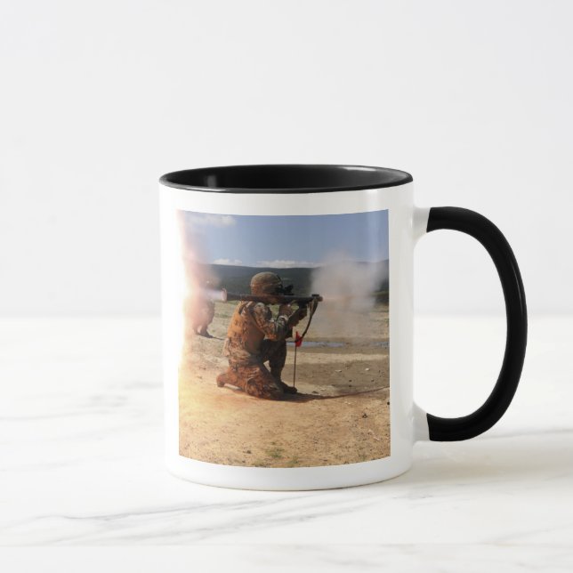 An assaultman fires a Rocket Propelled Grenade Mug (Right)