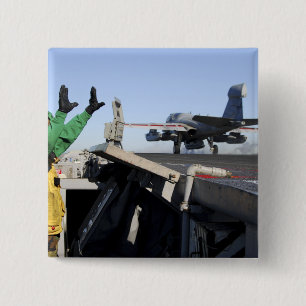 An EA-6B Prowler launches from the flight deck 15 Cm Square Badge