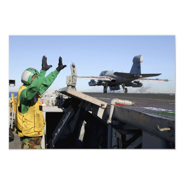 An EA-6B Prowler launches from the flight deck Photo Print (Front)