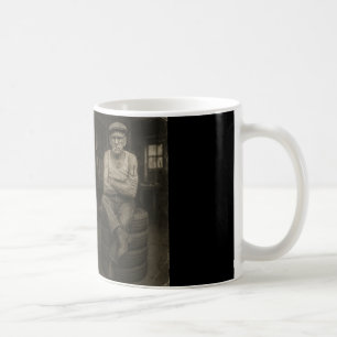 An elderly couple of mechanics in an old garage. coffee mug