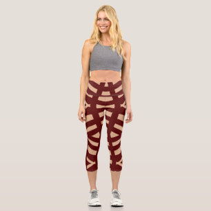 An elegant brown all over fabric print pattern c capri leggings