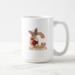 An elegant gold balloon in the shape of the letter coffee mug