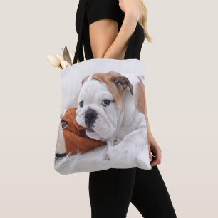 An English Bulldog Puppy Playing With A Bulldog Tote Bag