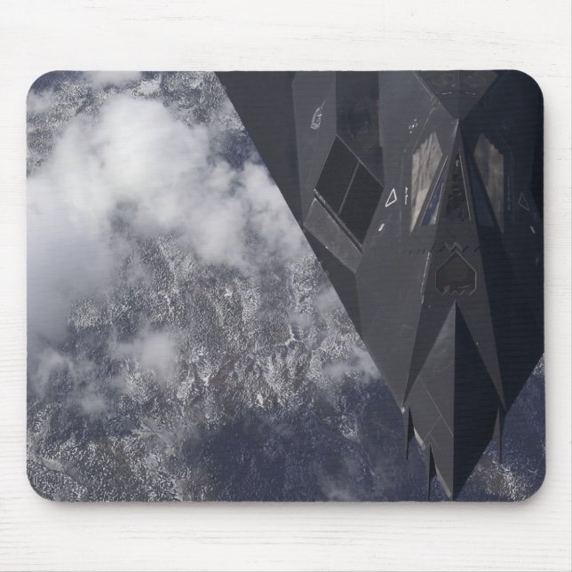 An F-117A Nighthawk flies high over the mountai Mouse Pad (Front)