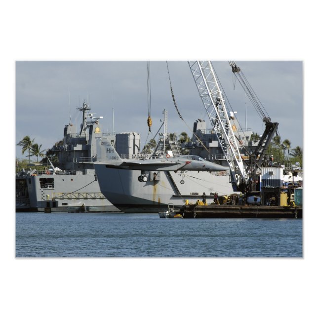 An F-15 Eagle gets a lift from a barge crane Photo Print (Front)