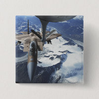 An F-15C Eagle aircraft sits behind a KC-135R