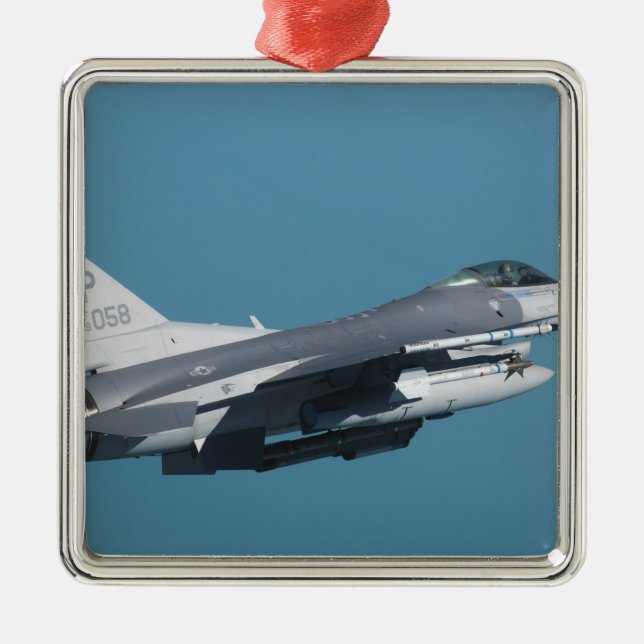 An F-16 Fighting Falcon in flight Metal Ornament (Front)
