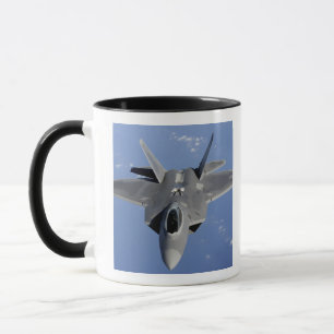 An F-22 Raptor moves into position to receive f 2 Mug