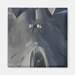An F-22 Raptor moves into position to receive f Magnet