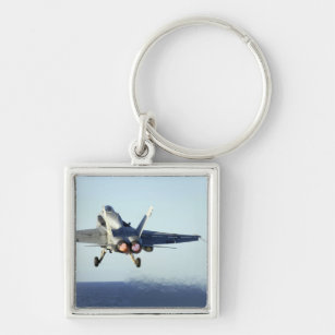 An F/A-18C Hornet launches from the flight deck Key Ring