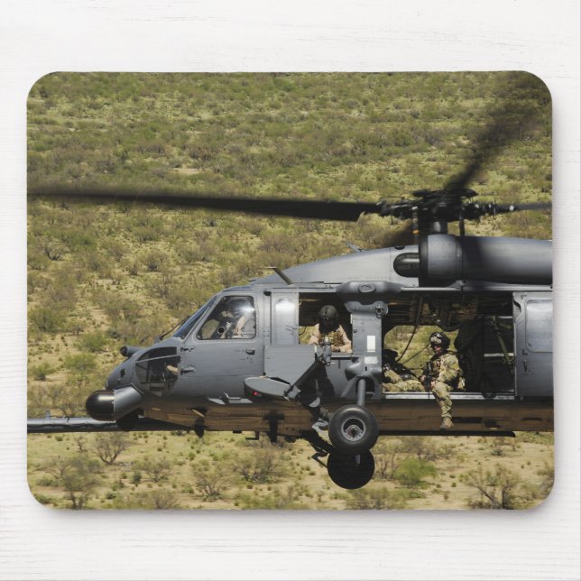 An HH-60 Pave Hawk flies over the desert Mouse Pad (Front)