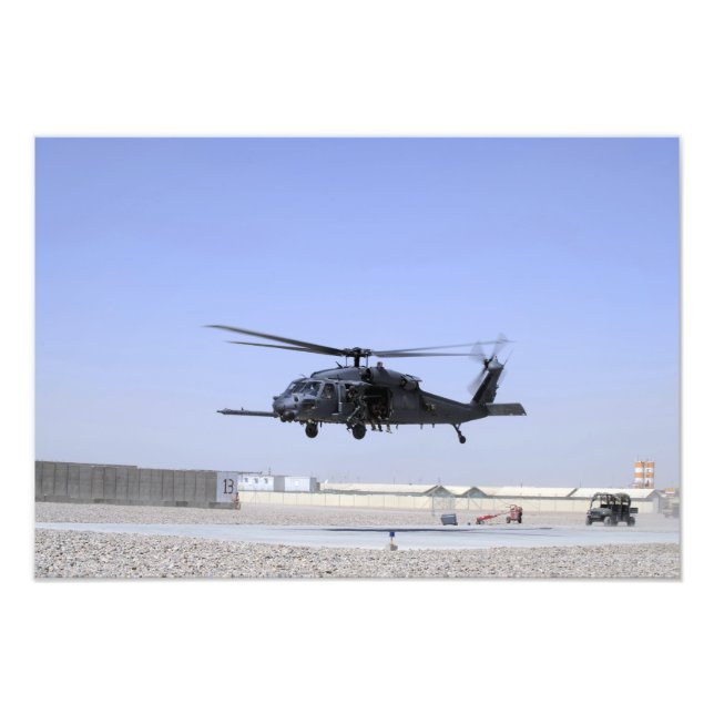 An HH-60G Pave Hawk taking off from Camp Bastio Photo Print (Front)