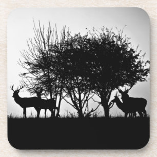 An image of some deer in the morning mist coaster