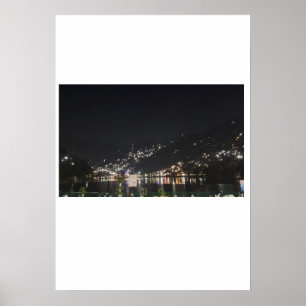 An immense view of lights on a peak. poster