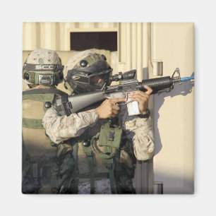 An infantry scout aims his weapon magnet
