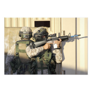 An infantry scout aims his weapon photo print