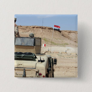 An instructor watches as an Iraqi army soldier 15 Cm Square Badge