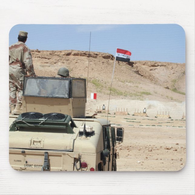 An instructor watches as an Iraqi army soldier Mouse Pad (Front)