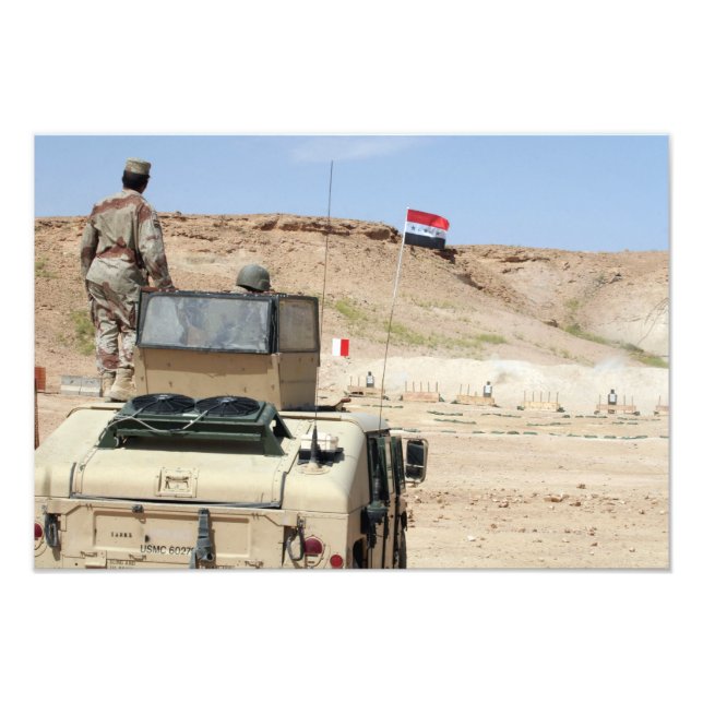 An instructor watches as an Iraqi army soldier Photo Print (Front)