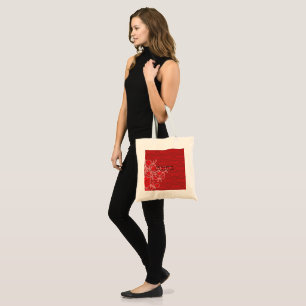 An intricate design of red and brown patterns, ele tote bag