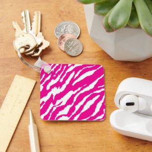An intricate floral pattern in pink and white, art key ring