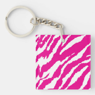 An intricate floral pattern in pink and white, art key ring