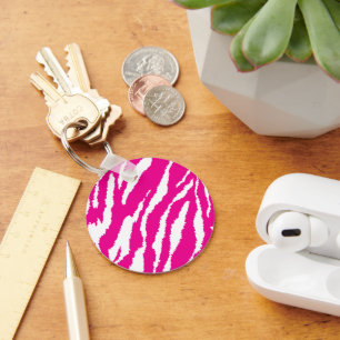 An intricate floral pattern in pink and white, art key ring