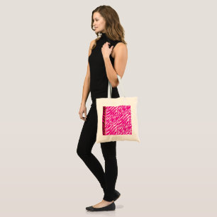 An intricate floral pattern in pink and white, art tote bag
