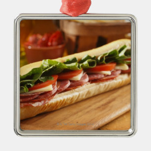 An Italian sub sandwich with 2 Metal Tree Decoration