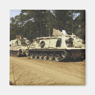 An M-88 recovery vehicle begins to tow an M992 Magnet