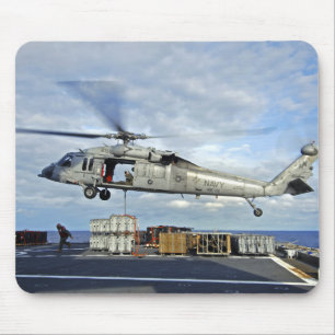 An MH-60S Seahawk prepares to deliver ammunitio Mouse Pad