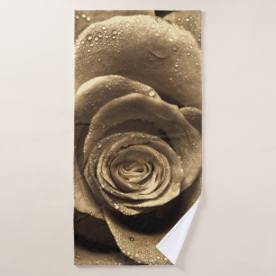 An old-fashioned rose close up, wet with water dro bath towel