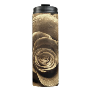 An old-fashioned rose close up, wet with water dro thermal tumbler