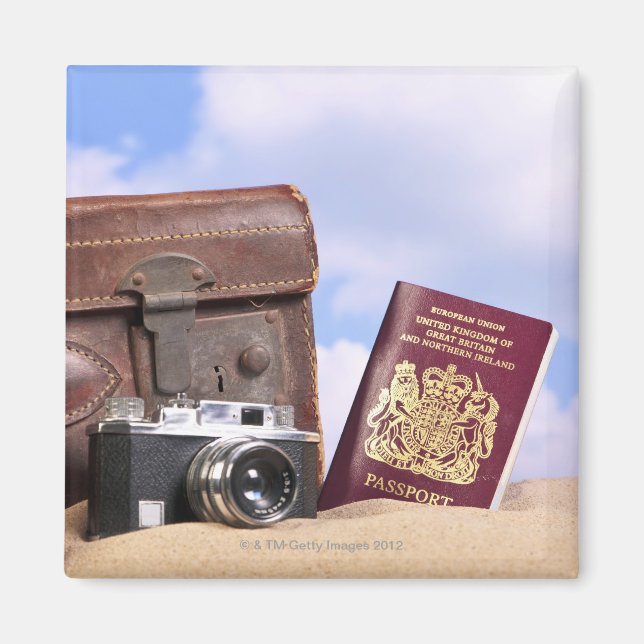 An old leather suitcase, retro camera and magnet (Front)