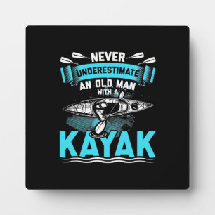 An Old Man With A Kayak Plaque