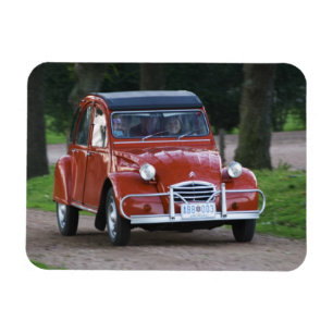 An old red Citroen 2CV car with a smiling woman Magnet