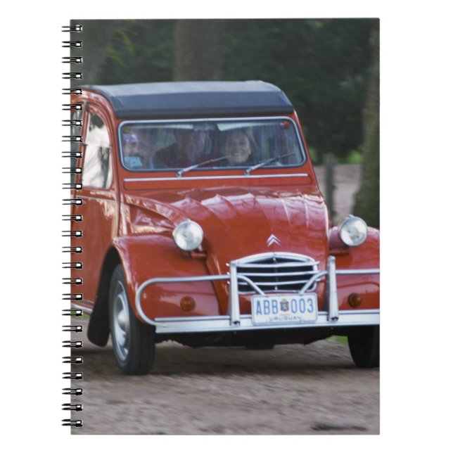 An old red Citroen 2CV car with a smiling woman Notebook (Front)